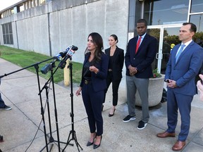 FILE - Attorney Alexandra Benevento, center, speaks with reporters during a news conference announcing a cheerleader abuse lawsuit filed in Tennessee on Sept. 27, 2022, in Memphis, Tenn. The latest lawsuit alleging widespread misconduct across competitive cheerleading says officials permitted two choreographers to continue working with young athletes after they were investigated for sexual abuse.