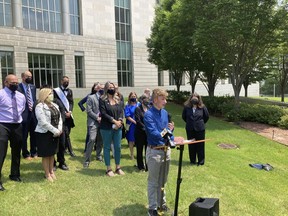 FILE - Dylan Brandt speaks at a news conference outside the federal courthouse in Little Rock, Ark., July 21, 2021. Brandt, a teenager, is among several transgender youth and families who are plaintiffs challenging a state law banning gender confirming care for trans minors. The nation's first trial on a ban on gender affirming care for children ended on Thursday, Dec. 1, 2022, as Arkansas wrapped up its case defending the prohibition with testimony from an endocrinologist opposed to such treatments for minors.