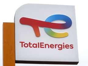FILE - The logo of French energy conglomerate TotalEnergies is seen at a gas station in Lille, northern France, Tuesday, March. 1, 2022. French oil giant TotalEnergies announced Friday Dec.9, 2022 its decision to withdraw its representatives from the board of Russian gas producer Novatek and to take a $3.7 billion write-down in its accounts.