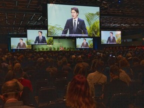Prime Minister Justin Trudeau delivers remarks during the opening ceremony of the COP15 UN conference on biodiversity in Montreal on Tuesday, Dec. 6, 2022. The COP15 conference on biodiversity loss is underway, but hundreds of delegates from developing countries are missing out due to visa issues.