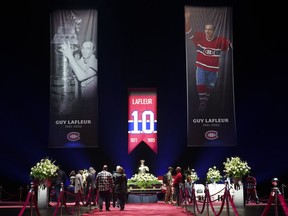 Fans pay their respect to former Montreal Canadiens Guy Lafleur during visitation at the Bell Centre in Montreal on Sunday, May 1, 2022.