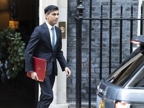 Britain's Prime Minister Rishi Sunak leaves 10 Downing Street to appear for the first time in front of the Commons Liaison Committee of select committee chairs in the House of Commons, in London, Tuesday Dec. 20, 2022.