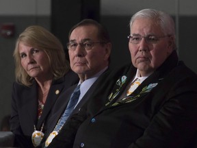 Commissioner Justice Murray Sinclair, Commissioner Chief Wilton Littlechild and Commissioner Marie Wilson (right to left) listen to a speaker as the final report of the Truth and Reconciliation commission is released, Tuesday, Dec. 15, 2015 in Ottawa. Seven years later, an Indigenous-led think tank says progress is moving at a "glacial pace."THE CANADIAN PRESS/Adrian Wyld