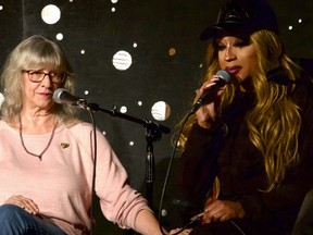 Lauren Mathers, director of Sandhills Pride, left, comforts drag queen Naomi Dix as she tears up while recounting the threats she received leading up to a recent drag performance while speaking on a panel with LGBTQ community leaders in Durham, N.C., on Thursday, Dec. 8, 2022.
