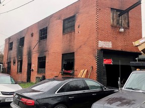 A burned-out warehouse is seen, Tuesday, Dec. 6, 2022, in Baltimore. A man was found dead inside the building Sunday morning, hours after firefighters extinguished the blaze.