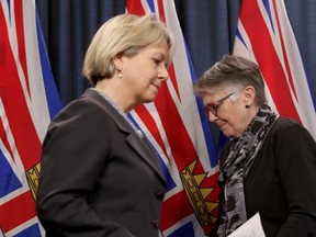 The British Columbia government will be using its provincial health registry system to contact parents of unvaccinated children in an attempt to increase flu vaccine rates among the province's youngest. Dr. Bonnie Henry and Dr. Penny Ballem take turns at the podium as they talk about B.C.'s COVID-19 immunization plan at the Legislature in Victoria on March 1, 2021.