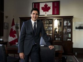 Prime Minister Justin Trudeau poses for a portrait in his office in Ottawa on Monday, Dec. 12, 2022.