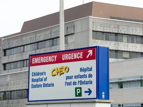 A sign directing visitors to the emergency department is shown at CHEO, Friday, May 15, 2015 in Ottawa. The Canadian Red Cross says it's coming to help the Children's Hospital of Eastern Ontario amid a surge of children and youth with respiratory illnesses.