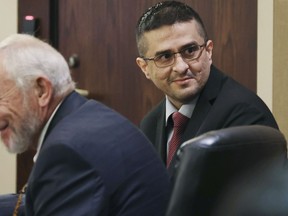 FILE - Capital murder defendant and former U.S. Border Patrol Juan David Ortiz looks around the courtroom before the start of the first day of the trial before Webb County State District Court Judge Oscar J. Hale, on Nov. 28, 2022. Jurors in Ortiz's capital murder trial have heard him confess in a taped interview in early December 2022 to killing four sex workers in South Texas.