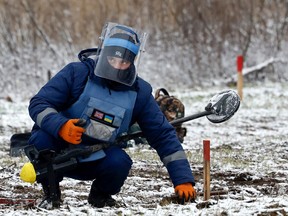 Deminers working for the HALO Trust clear mines from former Russian frontline positions Myla district on November 17, 2022 in Kyiv, Ukraine. In recent days, Russia has retreated from the Ukrainian city of Kherson, allowing Ukraine to reclaim swaths of nearby territory occupied since shortly after the Russian invasion on February 24, 2022.
