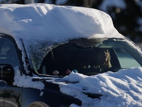 A motorist with snow on their car drives in Richmond, B.C., on Wednesday, Dec. 21, 2022. Warmer weather is set to arrive in parts of British Columbia by Christmas Eve but forecasters warn it's going to get messy.