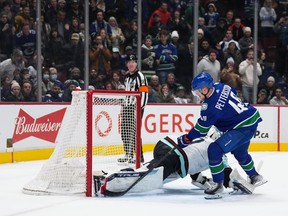 Vancouver Canucks' Elias Pettersson, of Sweden, scores the winning goal against Seattle Kraken goalie Martin Jones during a shootout during an NHL hockey game in Vancouver, on Thursday, December 22, 2022.