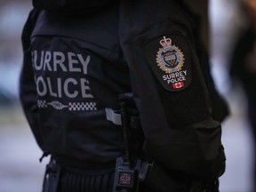A Surrey police department logo is seen on an officer's jacket in Surrey, B.C., Monday, Oct. 31, 2022. The Surrey Police Service has submitted a report to the province calling on it to reject the city's request to halt the transfer of policing from the RCMP, saying that reversing the transition would be "time consuming, complicated and costly."