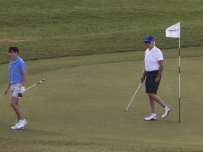 President Joe Biden plays golf with grandson Hunter Biden, left, at The Buccaneer in Christiansted, U.S. Virgin Islands, Friday, Dec. 30, 2022.