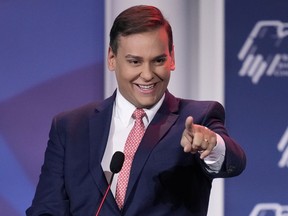 FILE - Rep.-elect George Santos, R-New York, speaks at an annual leadership meeting of the Republican Jewish Coalition, Nov. 19, 2022, in Las Vegas. Weeks after winning a district that helped Republicans secure their razor-thin House majority, the congressman-elect Santos is under investigation in New York after acknowledging he lied about his heritage, education and professional pedigree as he campaigned for office.