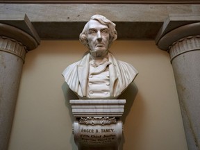 FILE - A marble bust of Chief Justice Roger Taney is displayed in the Old Supreme Court Chamber in the U.S. Capitol in Washington, on March 9, 2020. The House approved a bill on Dec. 14, 2020, that calls for removing the bust of Taney who wrote the infamous 1857 Dred Scott decision that upheld slavery and denied citizenship to Black Americans.