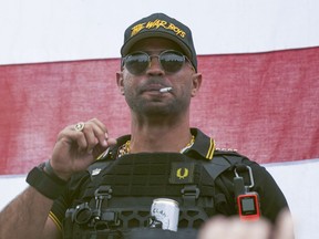 FILE - Proud Boys leader Henry "Enrique" Tarrio wears a hat that says The War Boys during a rally in Portland, Ore., on Sept. 26, 2020. A legal fight has erupted over a Washington D.C. police officer who was communicating with Tarrio in the run-up to the Jan. 6, 2021, Capitol attack that could shape the outcome of the upcoming trial of Tarrio and other far-right extremists.