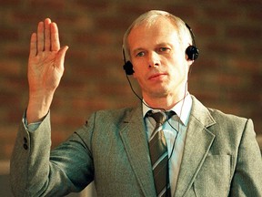 FILE - Janusz Walus, Polish immigrant and convicted killer of South African Communist Party leader Chris Hani, is sworn in during a Truth and Reconcilliation Commission hearing in Pretoria, South Africa, on Nov. 24, 1997. Walus has been released from prison in the capital Pretoria after serving more than 28 years for the 1993 murder.