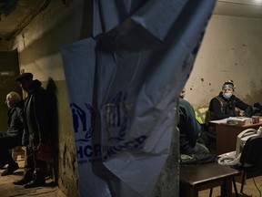 Local residents wait for their turn to get a medical aid from charitable organization Frida volunteers in a basement in Bakhmut, the site of the heaviest battles with the Russian invaders, in the Donetsk region, Ukraine, Sunday, Dec. 18, 2022. Ukrainian-Israeli mission FRIDA provides emergency medical relief to the most vulnerable of Ukrainian citizens who have suffered from the Russian aggression and are in need of medical care.