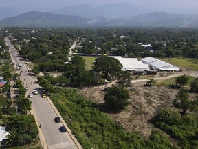Tents are set up by Mexican migration authorities in San Pedro Tapanatepec, Oaxaca, Mexico Wednesday, Oct. 5, 2022. The Mexican government has dismantled this migrant camp where tens of thousands migrants have obtained temporary transit documents on their way to the United States border.