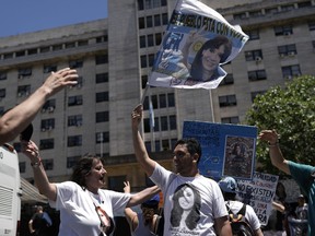 Supporters of Argentine Vice President Cristina Fernandez, a former president, rally outside the court where judges are expected to announce the verdict in a corruption case against her in Buenos Aires, Argentina, Tuesday, Dec. 6, 2022. The banner reads in Spanish "Everyone with Cristina." Three judges will soon announce their verdict in the corruption trial of Fernandez, accused of running a criminal organization that fraudulently directed about $1 billion in public works projects to her longtime ally when she was president.