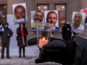 Montrealers mark the fifth anniversary of the Quebec City mosque shootings with a community gathering outside Metro Parc in Montreal on Jan. 29, 2022.