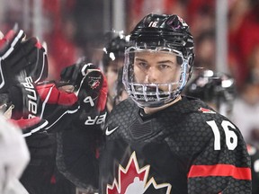 Connor Bedard celebrates his goal with teammates on the bench during the first period against Team Slovakia in the quarterfinals of the 2023 IIHF World Junior Championship on Jan. 2.