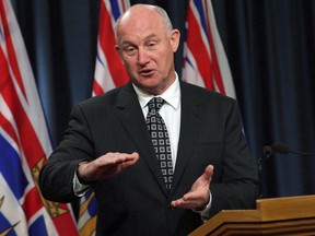 Minister of Public Safety Mike Farnworth speaks to media in Victoria, B.C., on Monday February 5, 2018. British Columbia's public safety minister says his government needs to know more before it decides on the "unprecedented" request to reverse a change from municipal policing in Surrey in a decision that affects the whole province.THE CANADIAN PRESS/Chad Hipolito