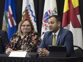 Yukon Deputy Premier Ranj Pillai takes questions from the media as Alberta deputy premier Sarah Hoffman looks on at the Western Premiers' Conference in Yellowknife, N.T., Wednesday, May 23, 2018