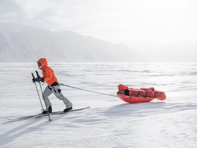 Caroline Côté trekking through Mittimatalik, Nunavut in 2022.