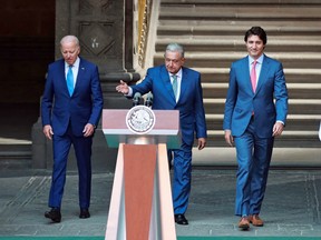 U.S. President Joe Biden, Mexican President Andres Manuel Lopez Obrador and Canadian Prime Minister Justin Trudeau walk to a joint news conference at the conclusion of the North American Leaders' Summit in Mexico City, Mexico, January 10, 2023.