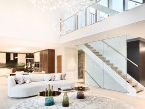 The main living area is the grandest space in the house, with 20 foot ceilings and a glass mezzanine that extends to the second floor.