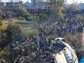 A general view of people gathered after the plane crash in Pokhara, Nepal January 15, 2023 in this picture obtained from social media.