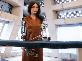 Robot Ai-Da, named after computing pioneer Ada Lovelace, creates “art” based on prompts.  Leon Neal / Getty Images