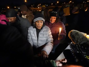 RowVaughn Wells, mother of Tyre Nichols, who died after being beaten by Memphis police officers, leaves at the conclusion of a candlelight vigil for Tyre, in Memphis, Tenn., Thursday, Jan. 26, 2023. The family is calling for calm across the United States as the country braces for visceral video evidence of another young Black man dying at the hands of police.