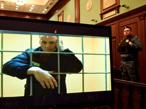 Russian opposition leader Alexei Navalny appears on a monitor  at a Moscow court via a video link from prison during an appeal against the nine-year prison sentence he was handed in March 2022 after being found guilty of embezzlement and contempt of court,  on May 24, 2022.