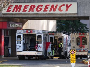 Ambulances line up outside the emergency department at Richmond General Hospital, in Richmond, B.C., on Nov. 27, 2022.