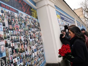 Defence Minister Anita Anand lays flowers at the Memorial Wall, to honour Ukraine's fallen heroes, in St. Michael's Square, in Kyiv, Ukraine, January 18, 2023.