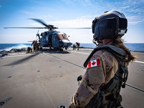 Members of the German Navy participate in helicopter touchdown exercises with HMCS Halifax's CH-148 Cyclone in the Mediterranean Sea during Operation Reassurance on Sept. 5, 2019. Canada needs to increase its defence spending dramatically to bring it in line with the NATO target and to purchase new frigates and fighter jets, writes Andrew Richter.