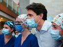 Prime Minister Justin Trudeau, centre, poses for a photograph with health-care workers at the Ottawa Hospital General Campus during the 2021 federal election campaign in Ottawa.