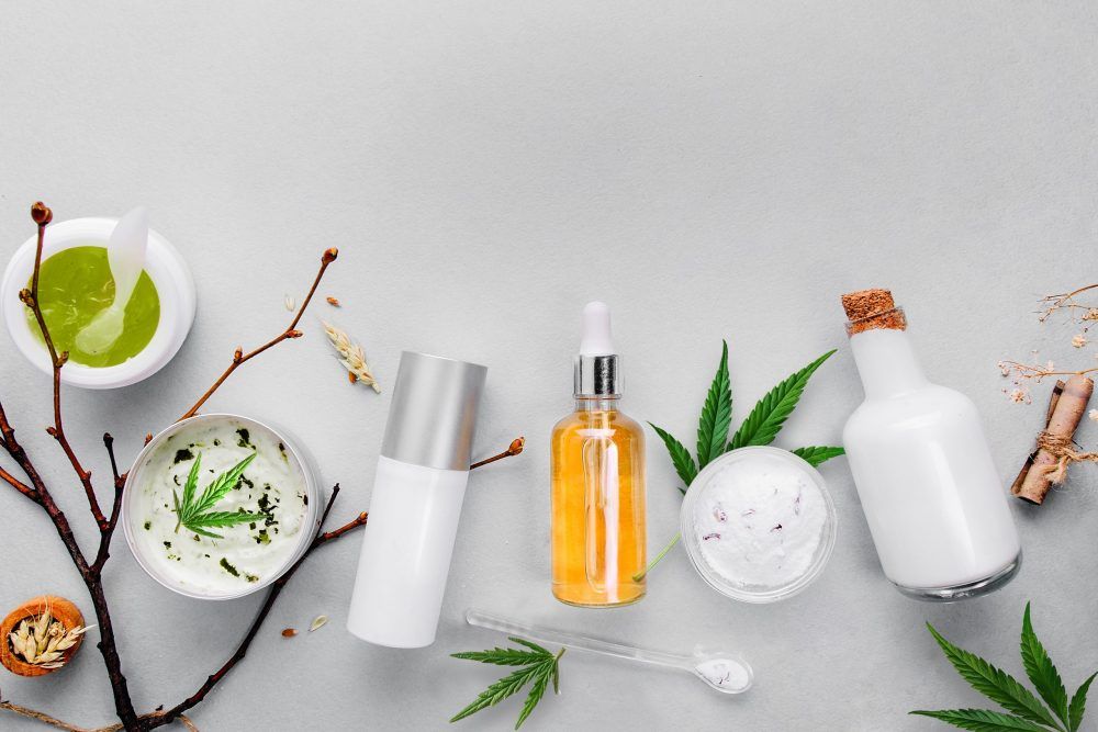 Cosmetics with cannabis CBD oil on light background. Concept skin care. Banner