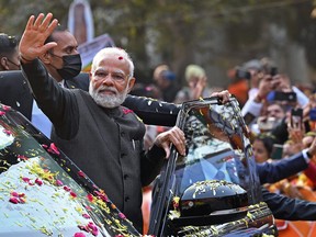 India's Prime Minister Narendra Modi waves to supporters in New Delhi on January 16, 2023. "Hinduphobia" is largely designed to mute criticism of Hindu nationalism generally and of human-rights abuses against Indian minorities under Modi's government, says one critic of the term.