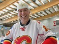 Former Calgary Flame  Jim Peplinski clowns around during an alumni game in 2014.