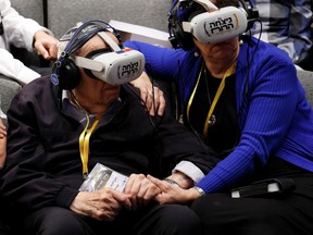 Holocaust survivor Menachem Haberman, 95, participates in a virtual guided tour of the former Nazi German concentration camp Auschwitz-Birkenau, where he was deported to in May, 1944, by using Virtual Reality headsets as part of an initiative named Triumph of the Spirit, that was developed by ultra-Orthodox women, in Jerusalem, January 23, 2023.