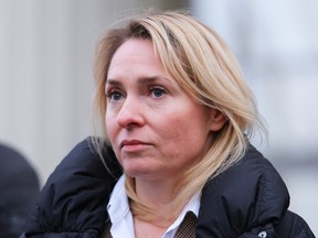 Svetlana Astrakhantseva, Executive Director of the Moscow Helsinki Group, one of Russia's oldest human rights organizations, leaves a court building after a hearing on the lawsuit to liquidate the organization, in Moscow, Russia January 25, 2023.