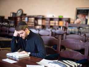 A Ukrainian Jew studies at a synagogue in Odesa.