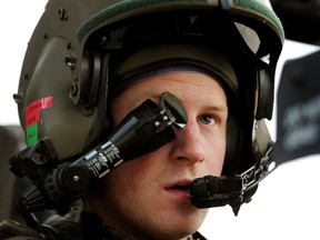 Prince Harry wears his monocle gun sight as he sits in the front seat of an Apache helicopter at the British controlled flight-line at Camp Bastion in Afghanistan's Helmand Province, where he was serving as a pilot/gunner with 662 Sqd Army Air Corps., December 12, 2012.