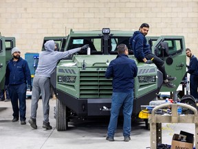 Employees work on the Senator APC at vehicle manufacturer Roshel after Canada's defence minister announced the supply of 200 Senator armoured personnel carriers to Ukraine.