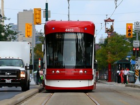 A TTC streetcar goes down Spadina Avenue in Toronto in August 2014.