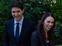 Prime Minister Justin Trudeau and New Zealand Prime Minister Jacinda Ardern are seen at a meeting at the official residence of the Canadian Ambassador in Paris on May 16, 2019. Ardern has announced she is resigning as PM.